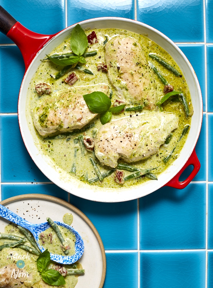 Creamy pesto chicken served in a cast iron pan